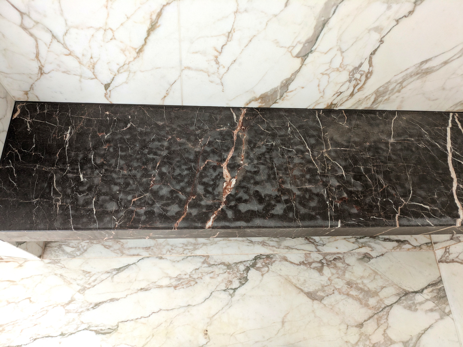 Before — dark marble border scratched